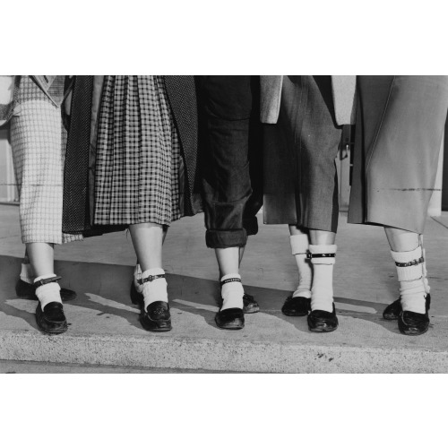 Legs And Feet Of Five Teenage Girls Wearing Dog Collar Anklets On Their Socks, 1953