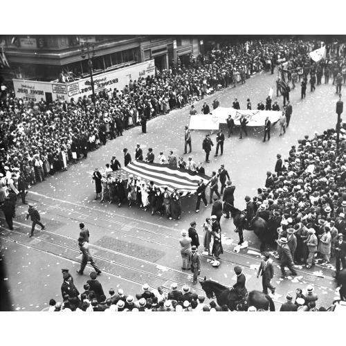 Female Film Industry Workers Carrying A Large American Flag As Part Of An National Recovery...