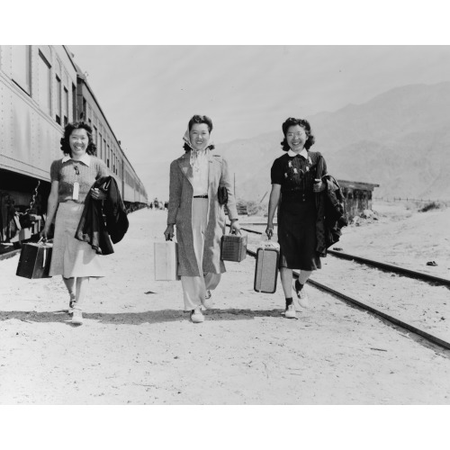 Lone Pine, Calif. May 1942--Three Japanese-American Girls With Suitcases, Who Have Just Arrived...