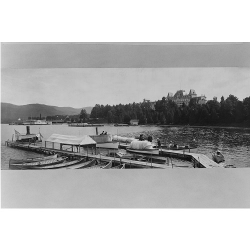 Piers, Boats, And People In Foreground, With Fort William Henry Hotel In Background, Lake...