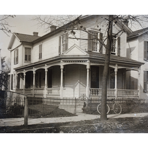 Front View Of 7 Hawthorn Street, The Wright Home, With Bare Trees And A Bicycle Resting By The...