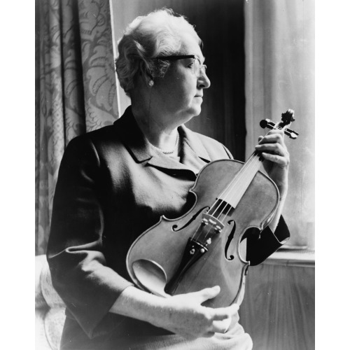 An Expert On The Violin, Dr. Apgar Examines An Instrument Fashioned From An Old Telephone Shelf, 1966