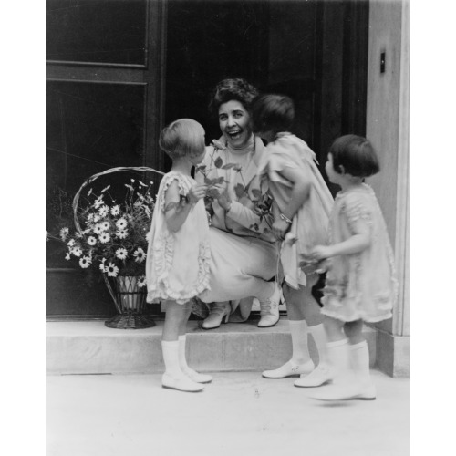 Mrs. Coolidge Gets A Basket Of Flowers And A Kiss, 1927