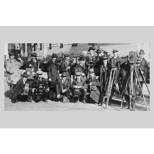 Group Portrait Of Seventeen Members Of The White House News Photographers' Association, Standing...