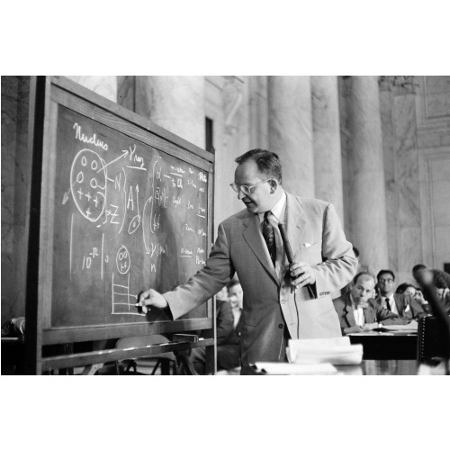 Dr. Mark Mills Drawing Diagrams On A Blackboard