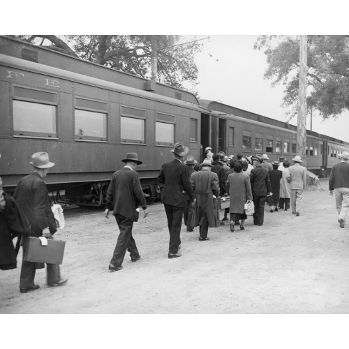 Evacuees Boarding A Special Train At Santa Anita (California) Assembly Center Enroute To A War...