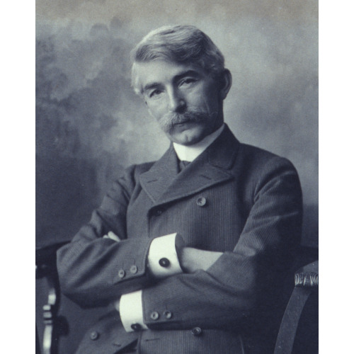 Portrait Of Man Wearing A Pinstripe Suit Seated With His Arms Crossed, 1900