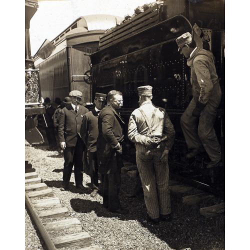Theodore Roosevelt Standing By A Railroad Car With Workers And Other Men, 1906