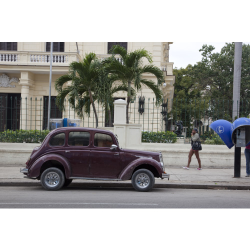 Vintage Car And Telephone Pods In Havana, Cuba, 2010