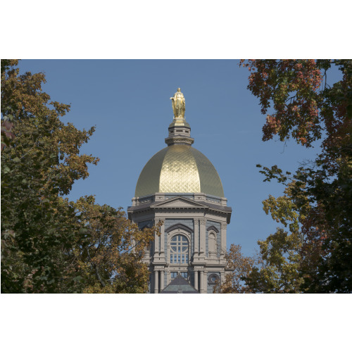 The Main Building's Gold Dome Topped By A Golden Statue Of St. Mary At The University Of Notre...