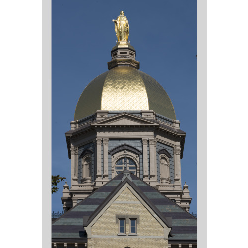 The Main Building's Gold Dome Topped By A Golden Statue Of St. Mary At The University Of Notre...