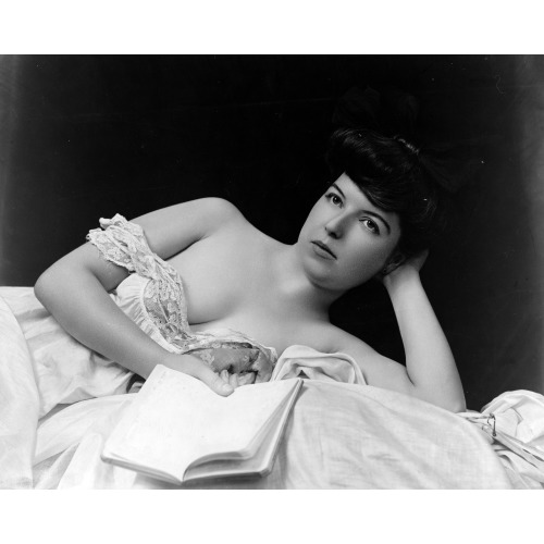 Young Woman, Wearing Negligee, Lying In Bed, Holding Book, circa 1900